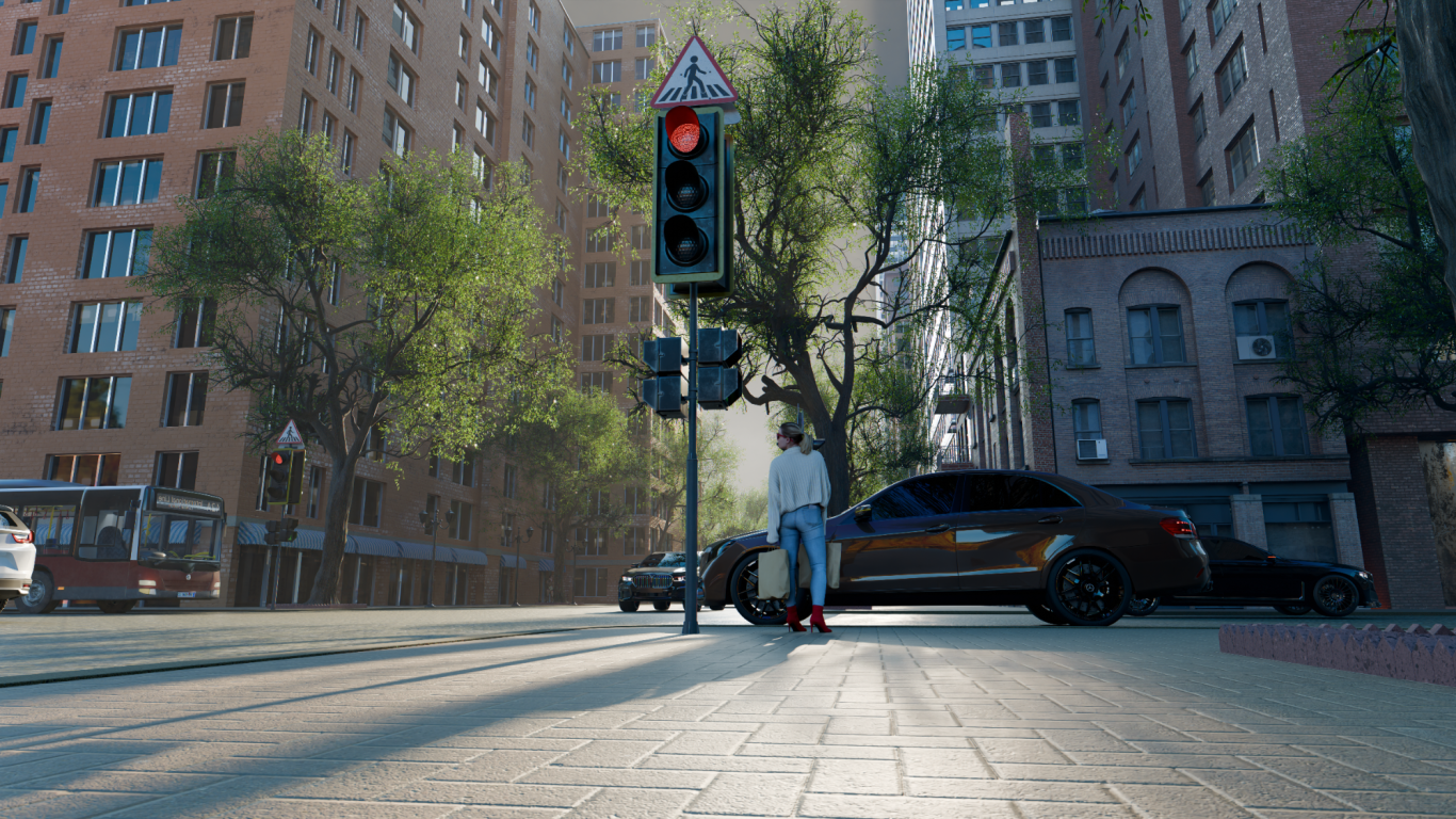 Busy street scene with cars and pedestrians, lined with trees and shops in the background.